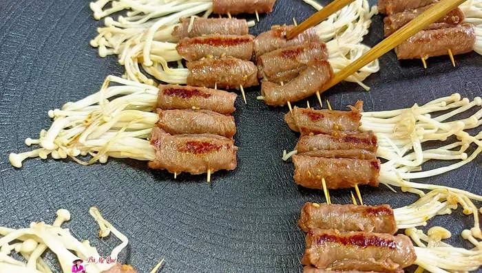 Grill until enoki mushrooms are cooked and the beef is fragrant.