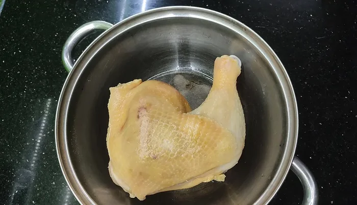 Rub the chicken with a little salt to firm the skin.