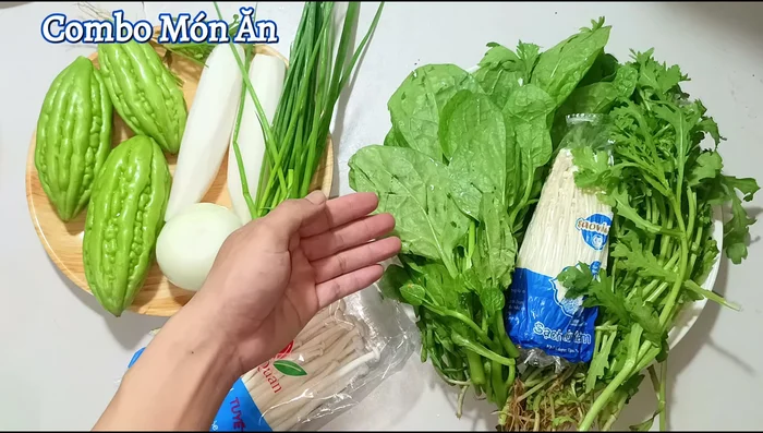 Wash and prepare all vegetables: Cut white radish, bitter melon (remove seeds), green onions, and coriander. Clean and separate enoki mushrooms and seafood mushrooms. Soak vegetables in salt water.