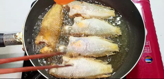 For extra crispiness, fry the fish twice on each side, ensuring it's golden brown.
