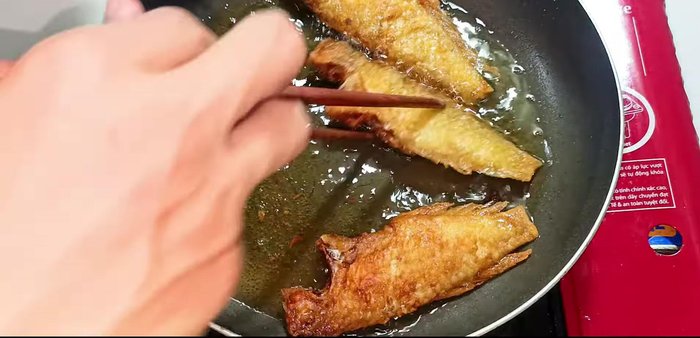 Remove the fish from the pan and turn off the heat. This helps prevent the fish from absorbing excess oil.