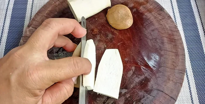 Cut remaining mushrooms in half, then into pieces and score them to mimic the look of squid. Blanch all mushroom pieces in boiling water for 1 minute.