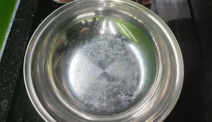 Boil the plum mixture on the stove to make it more watery. Discard the plum pulp or dry it to make plum peel jam.